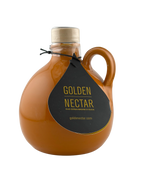 Round, orange, painted ceramic container containing Golden Nectar, Organic, Extra Virgin, Olive Oil