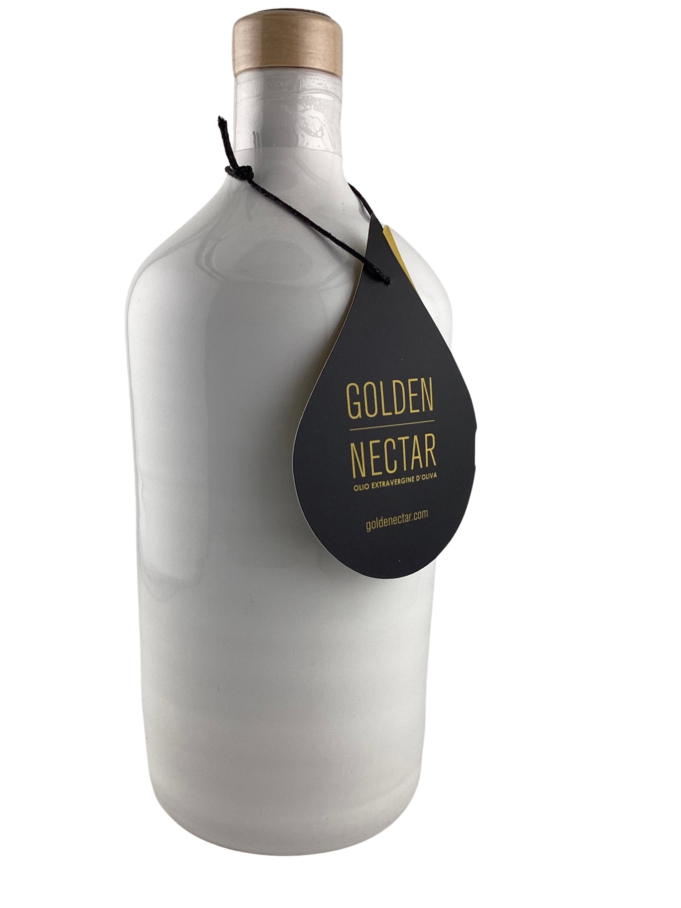A tall, solid white painted ceramic bottle containing olive oil