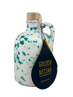 short, white ceramic container, speckled with turquoise paint, containing Golden Nectar, Organic, Extra Virgin, Olive Oil