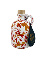 Short, white ceramic container, speckled with orange paint, containing Golden Nectar, Organic, Extra Virgin, Olive Oil