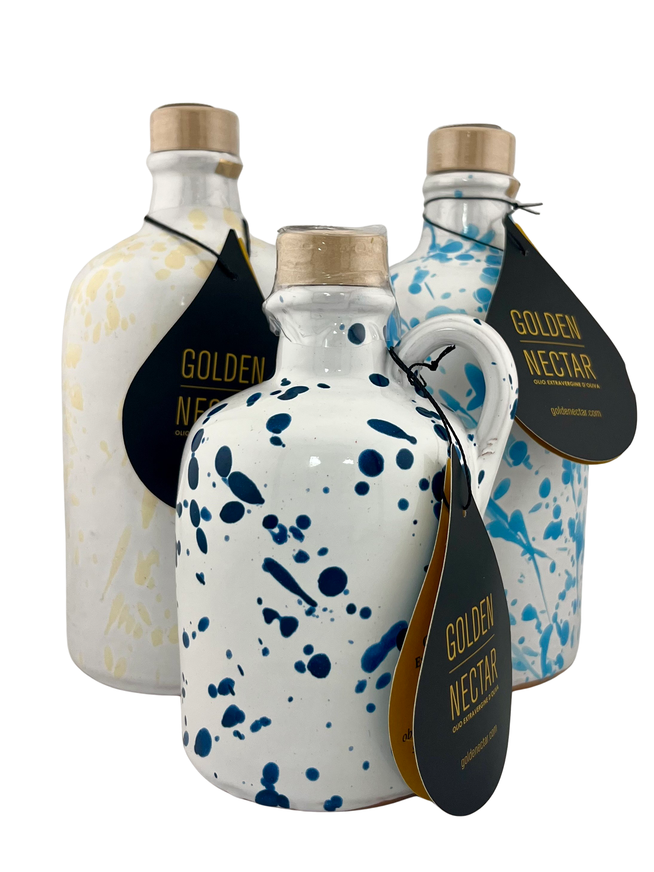 A collection of white ceramics with colored, speckled paint. One with yellow speckles, one with light blue speckles and the other dark blue 