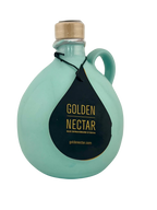 Round, blue, painted ceramic container containing Golden Nectar, Organic, Extra Virgin, Olive Oil