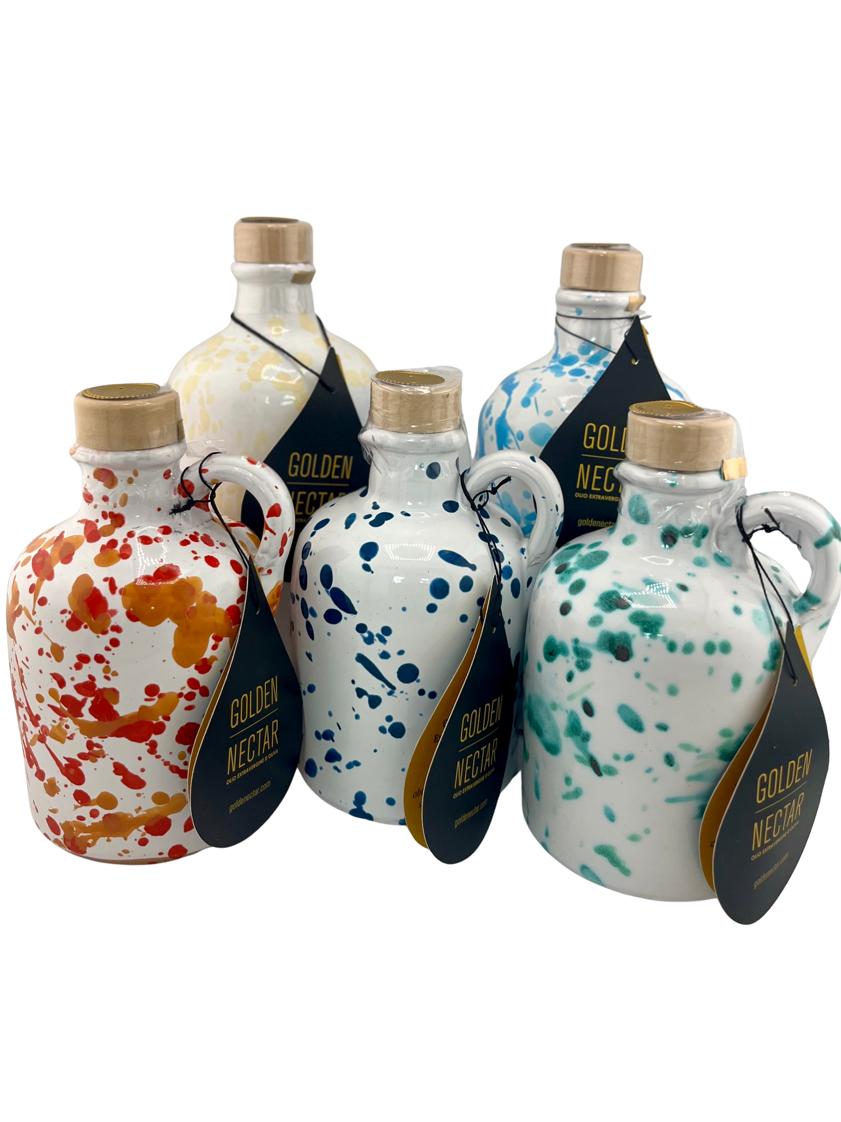 A collection of white ceramics all different sizes with different colored speckled designs and containing Golden Nectar, Organic, Extra Virgin, Olive Oil